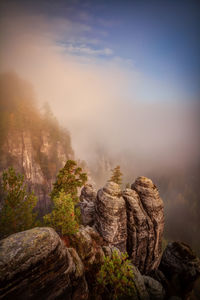 Rock formation on mountain against sky