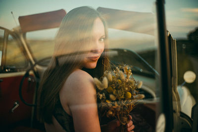 Portrait of woman in car