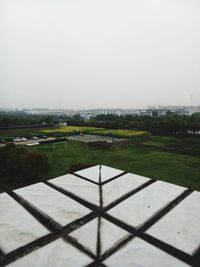 Scenic view of green landscape against clear sky