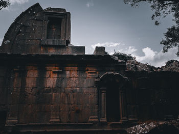 Low angle view of old building against sky