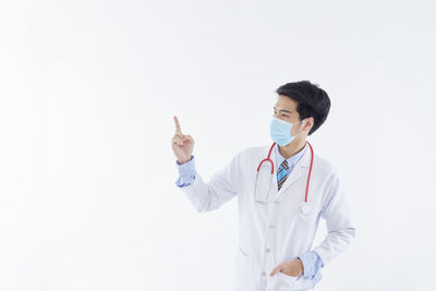 Man standing against white background