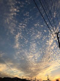 Low angle view of silhouette building against sky