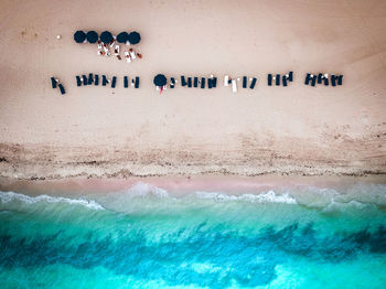 High angle view of text on beach