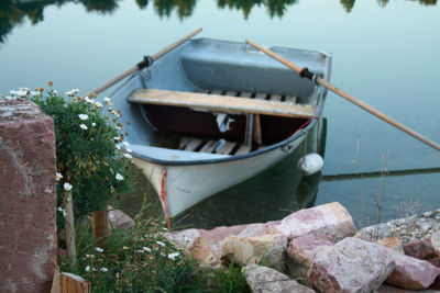 Boat moored at lakeshore