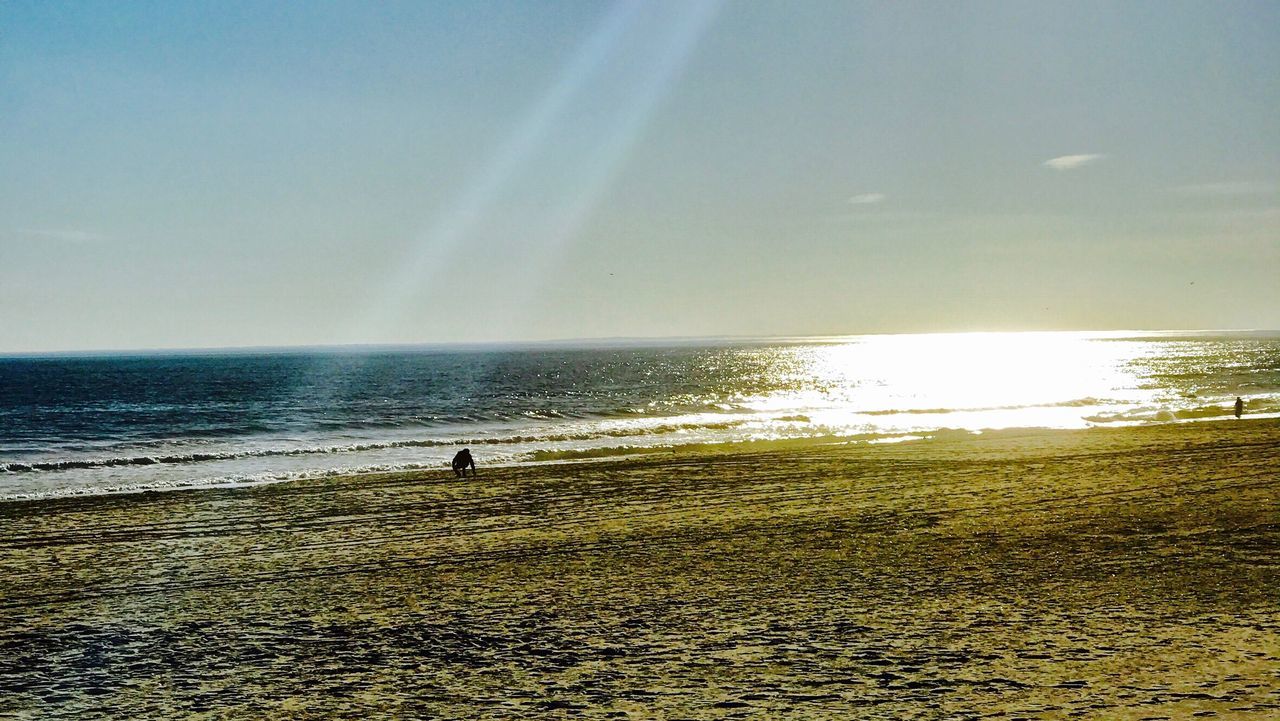 sea, beach, horizon over water, water, sky, sunlight, real people, nature, sand, outdoors, lifestyles, leisure activity, vacations, one person, beauty in nature, scenics, tranquility, men, day, people, one man only, adult