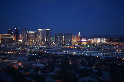 Illuminated cityscape at night