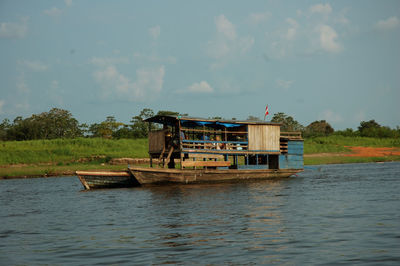 Boat in lake against sky