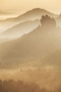 Scenic view of mountains against sky during sunset