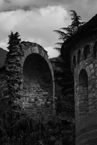 Low angle view of old ruin building against sky