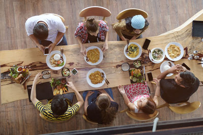 High angle view of family having lunch at table