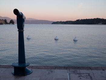 Scenic view of sea against sky at sunset