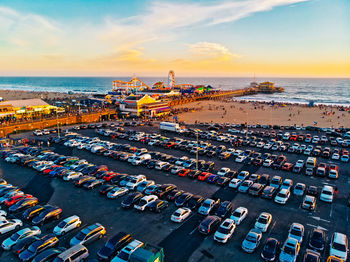 High angle view of beach by sea against sky during sunset