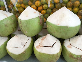 Fresh coconuts slightly cut open lid