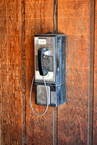 Telephone on wooden wall