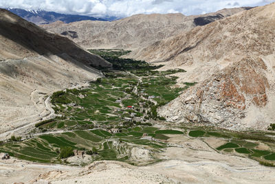 Scenic view of mountains against clouds