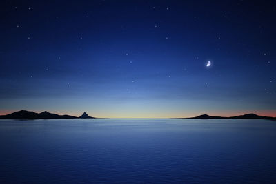 Scenic view of sea against sky at night