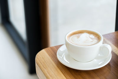 Close-up of cappuccino on table