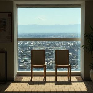 Chairs on beach against sky
