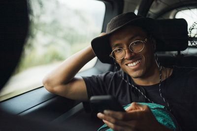 Portrait of young man using mobile phone