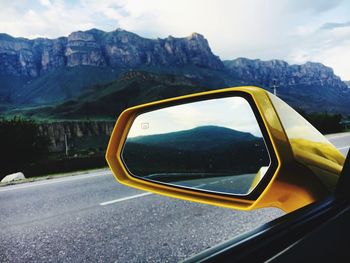 Reflection of car on side-view mirror