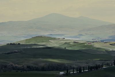Scenic view of landscape and mountains against sky
