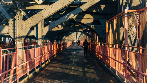 People on williamsburg bridge in city 