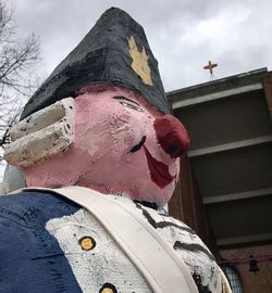 Low angle view of statue against building