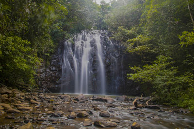 Beautiful waterfall with long exposure taken in the rainforest in queensland australia