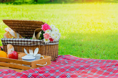 Close-up of cake served on wooden table in field