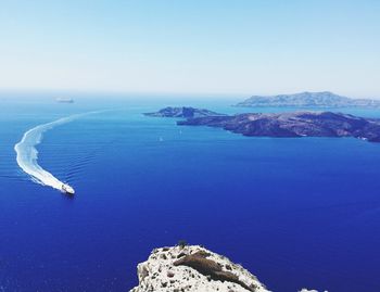 Scenic view of sea and mountains against sky