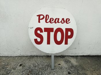 Close-up of sign on wall