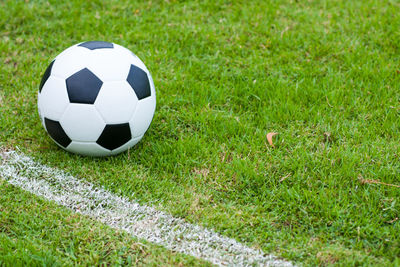 Close-up of soccer ball on grass