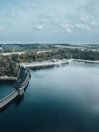 Bridge over river against sky