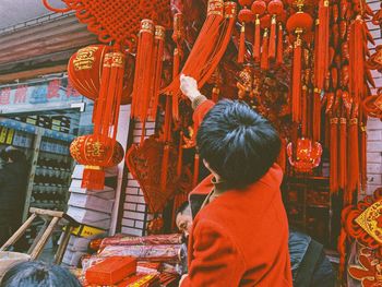 Rear view of woman hanging in temple