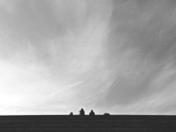 People on field against sky