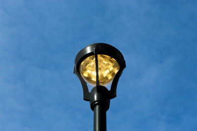 Low angle view of street light against sky