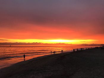 Scenic view of beach against sky during sunset