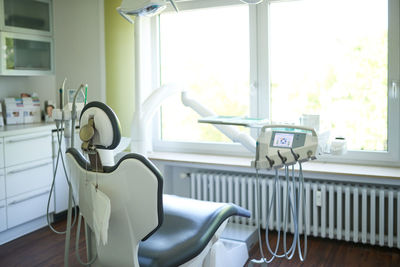 Empty dentist chair with equipment at clinic