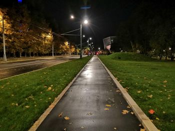 Street lights on road in city at night