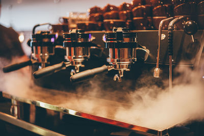 Close-up of steam emitting from espresso maker