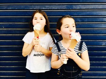 Portrait of smiling friends holding ice cream