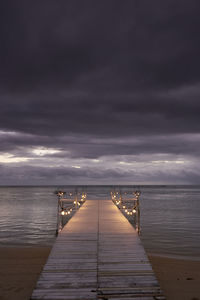 Pier over sea against sky