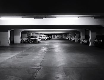Cars in illuminated underground at night