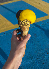 Close-up of hand holding ice cream