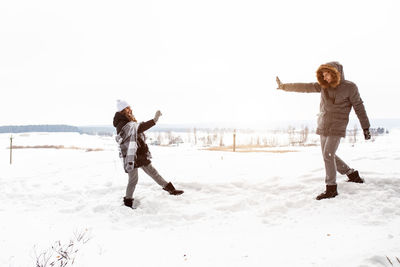Full length of woman on snow covered land
