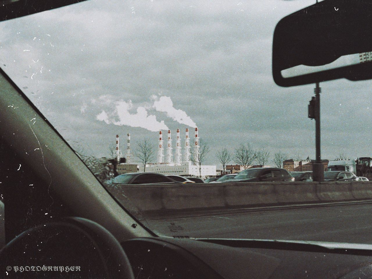 CARS ON ROAD SEEN THROUGH GLASS