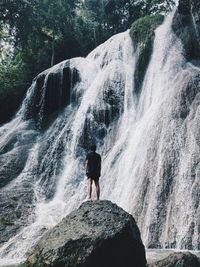 Standing on waterfall