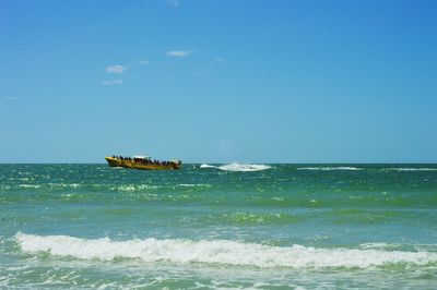 Scenic view of sea against blue sky