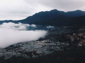 Scenic view of snow covered mountains against sky