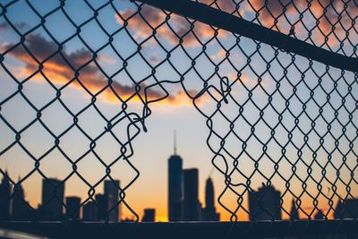 City seen through chainlink fence